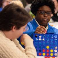 people playing connect 4 game